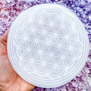 These beautiful Selenite Charging Plates with a flower of life pattern are perfect to use for charging your crystals. Placing your crystals on the charging plate will cleanse and recharge them of their existing energy. These can also be used for Crystal Grid Work.